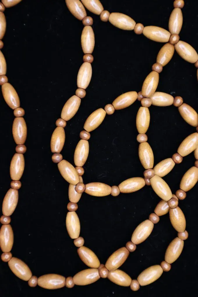 Natural wooden bead necklace with smooth finish.