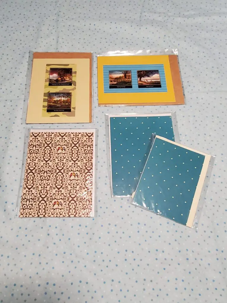 Assorted decorative notepads in clear packaging.