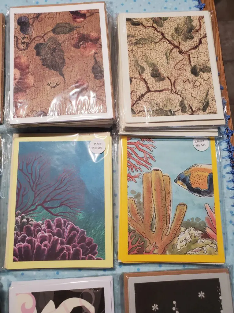 Assorted greeting cards with ocean-themed designs.