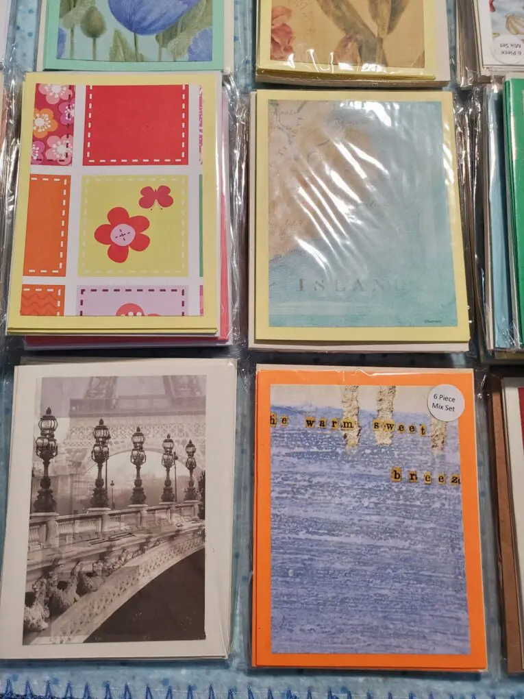 Assorted colorful notecards in protective sleeves.