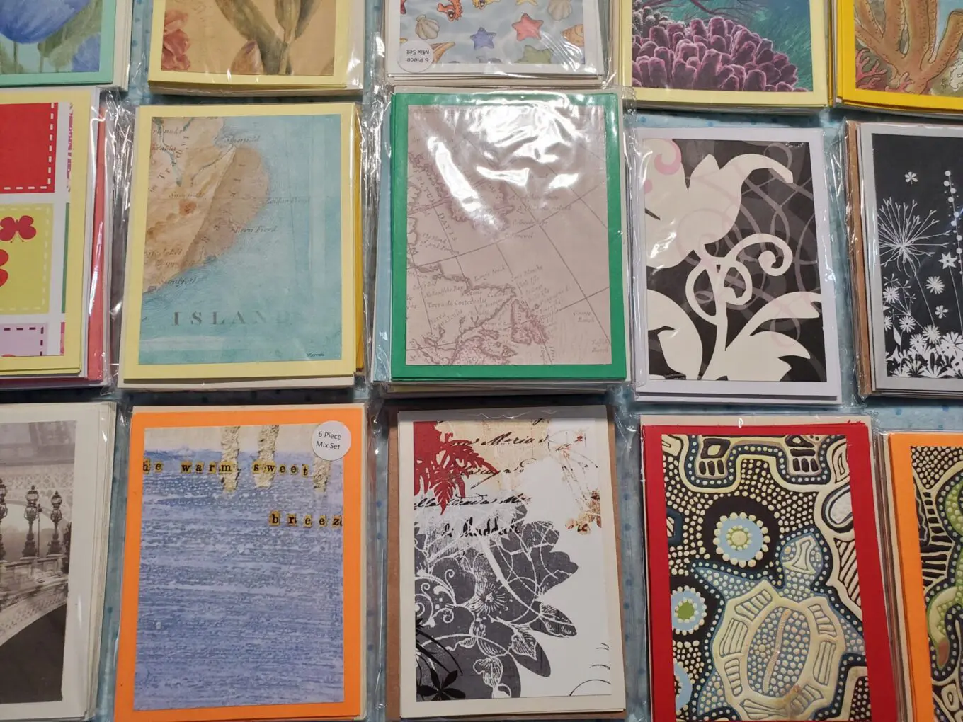Assorted colorful cards with various artistic designs.