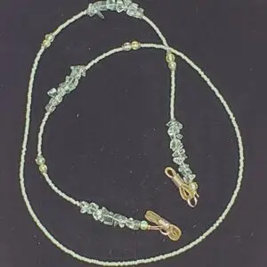 Beaded necklace with green and gold accents.