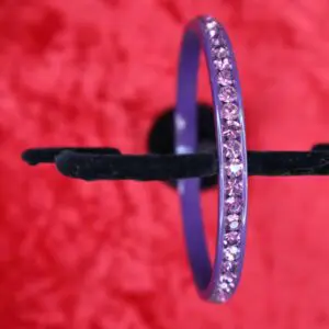 Purple bangle bracelet adorned with sparkling gems.