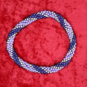 Colorful beaded necklace with purple and gold.