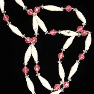 Colorful necklace featuring pink and cream beads.