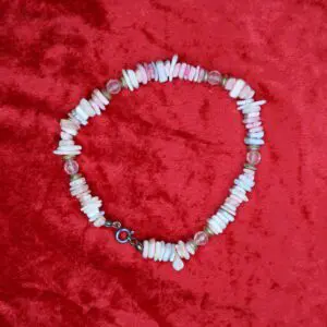Beaded necklace with pink and clear accents.