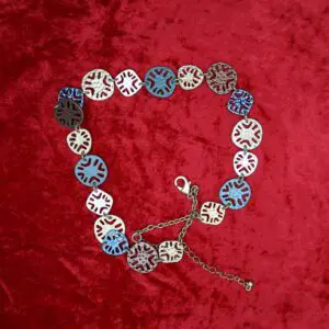 Colorful necklace with unique circular pendant design.