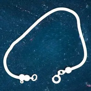 White bracelet displayed on a dark background.