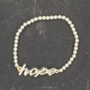 Silver bracelet with "hope" charm design.