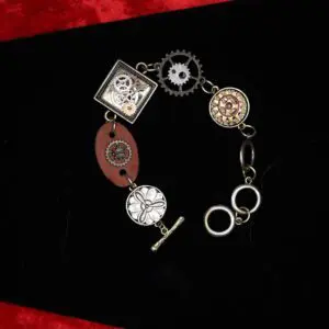 Steampunk-inspired bracelet with gears and charms.