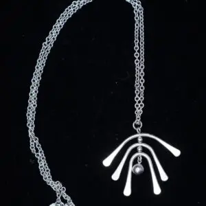 Silver necklace with unique curved pendant design.