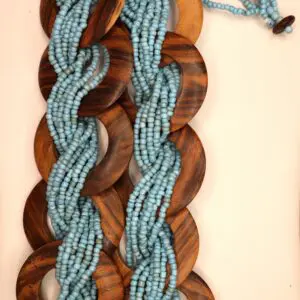 Braided necklace with wooden and blue beads.