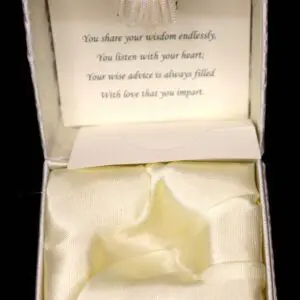 Open jewelry box with heartfelt message inside.
