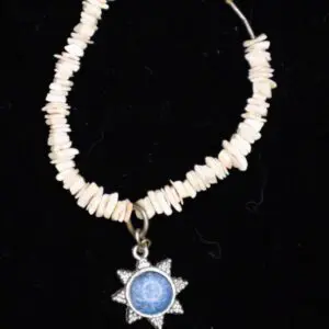 Beaded necklace with star pendant charm.