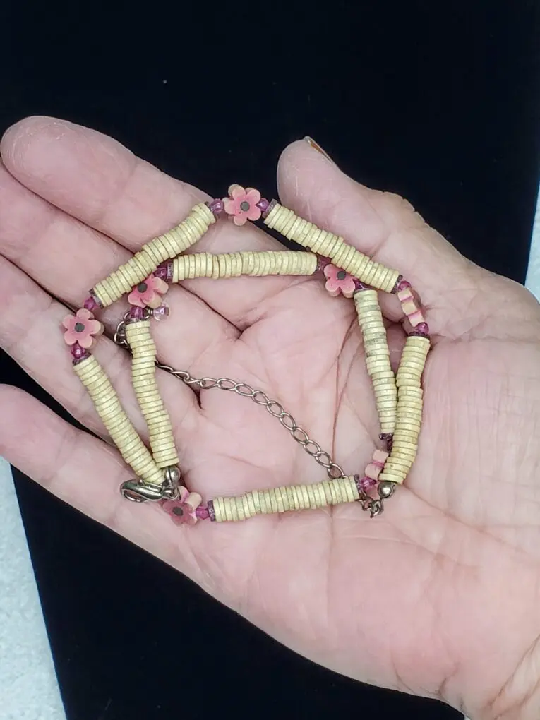 Colorful bracelet with floral and wooden beads.