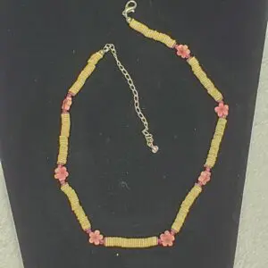 Colorful beaded necklace with flower accents.