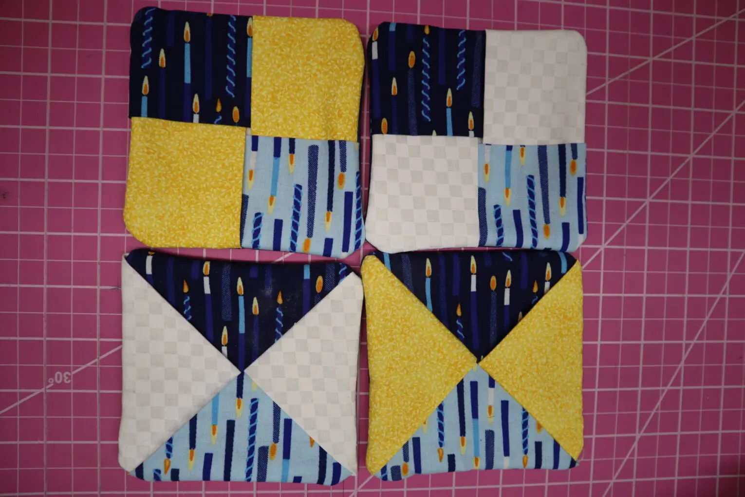 Colorful quilted squares with various patterns.