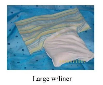 A large striped cover with a white liner underneath.