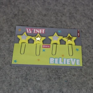 Two colorful paper clips with stars and words 'WISH' and 'BELIEVE'.