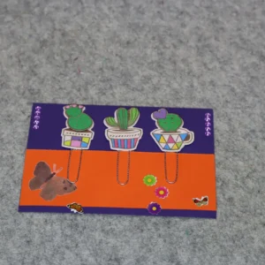 A colorful card with illustrations of a cat and a mouse playing games.