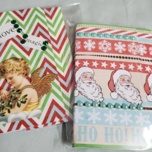 Two festive holiday gift bags with Christmas designs.