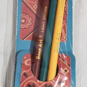 Colorful pencils in a decorative holder on a patterned surface.